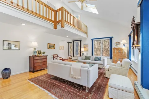 a living room with furniture and a table