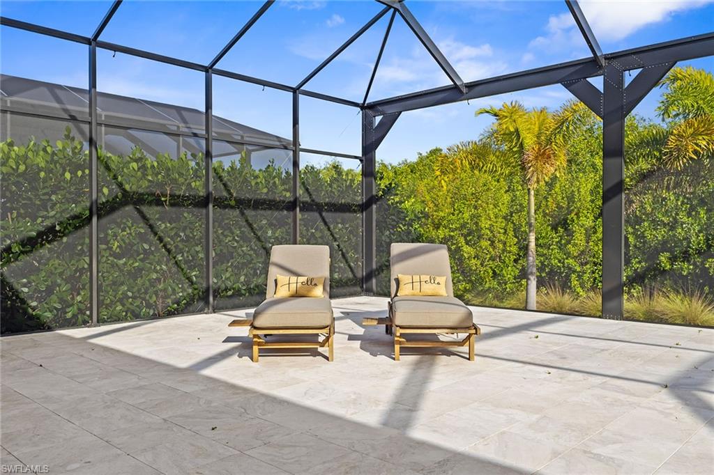 8829 Paradera Court Naples, FL 34112 - Photo 23 of 31 a view of a chairs and table in the patio