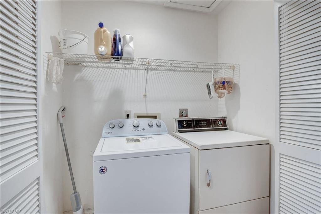 115 Georgetown Boulevard, Unit 115 Naples, FL 34112 - Photo 21 of 45 a utility room with dryer and washer