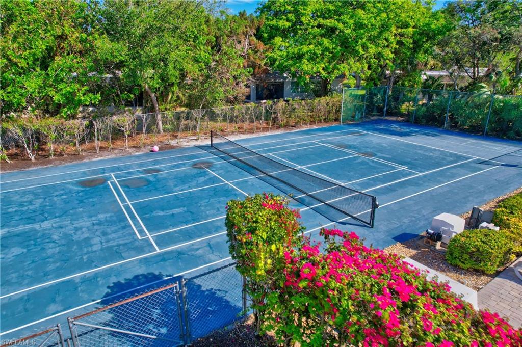 115 Georgetown Boulevard, Unit 115 Naples, FL 34112 - Photo 26 of 45 a view of a tennis court