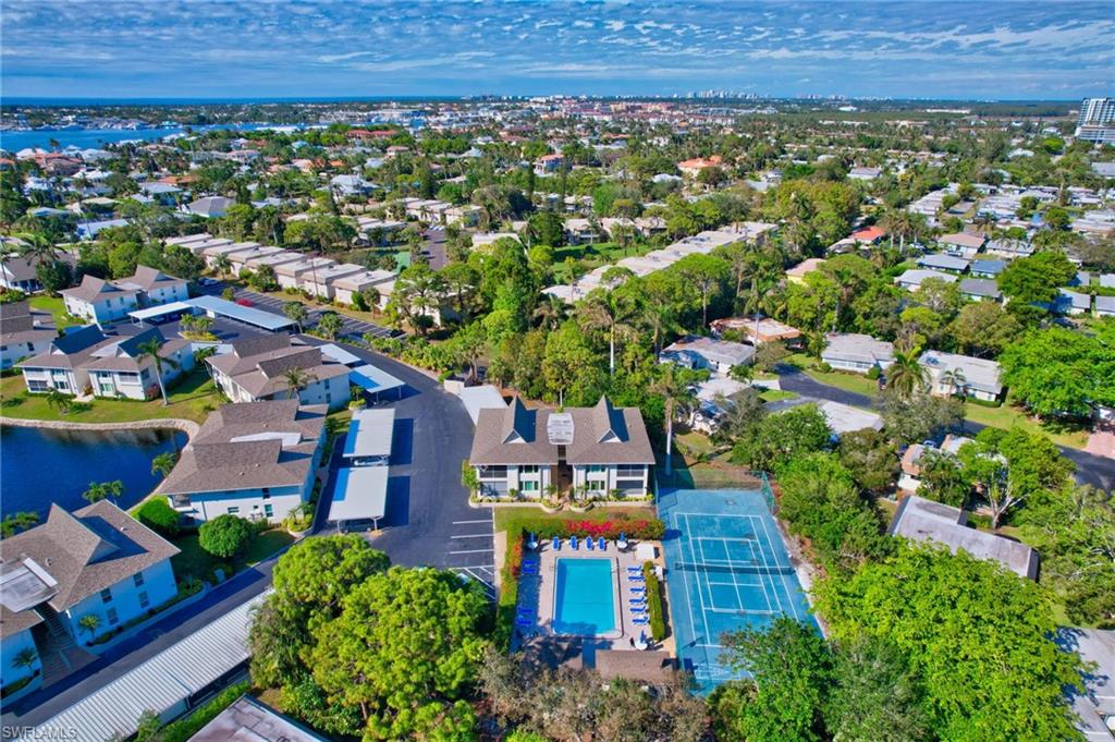 115 Georgetown Boulevard, Unit 115 Naples, FL 34112 - Photo 30 of 45 an aerial view of a house with a garden