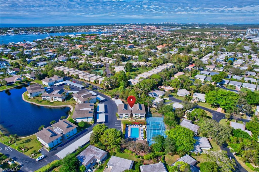 115 Georgetown Boulevard, Unit 115 Naples, FL 34112 - Photo 31 of 45 an aerial view of multiple house