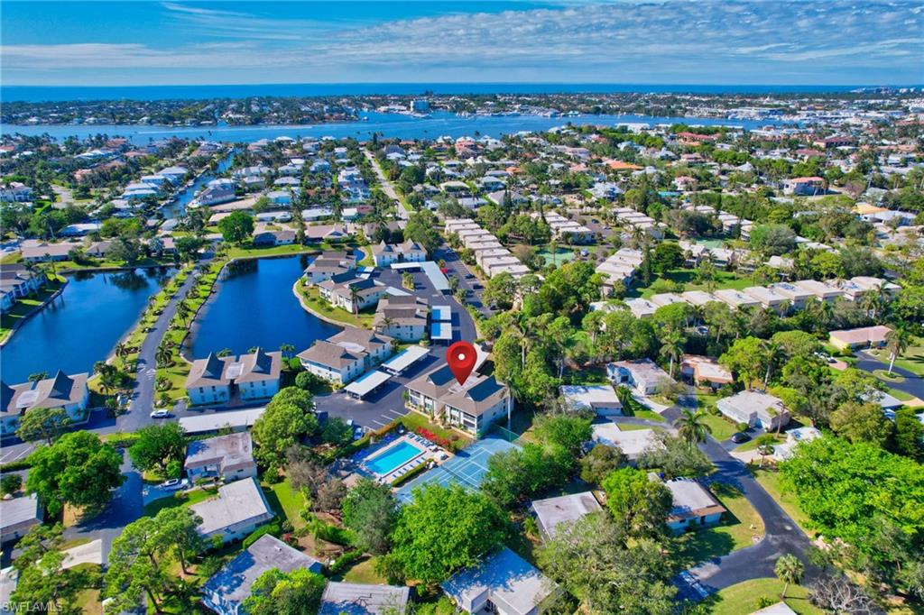 115 Georgetown Boulevard, Unit 115 Naples, FL 34112 - Photo 32 of 45 an aerial view of multiple house