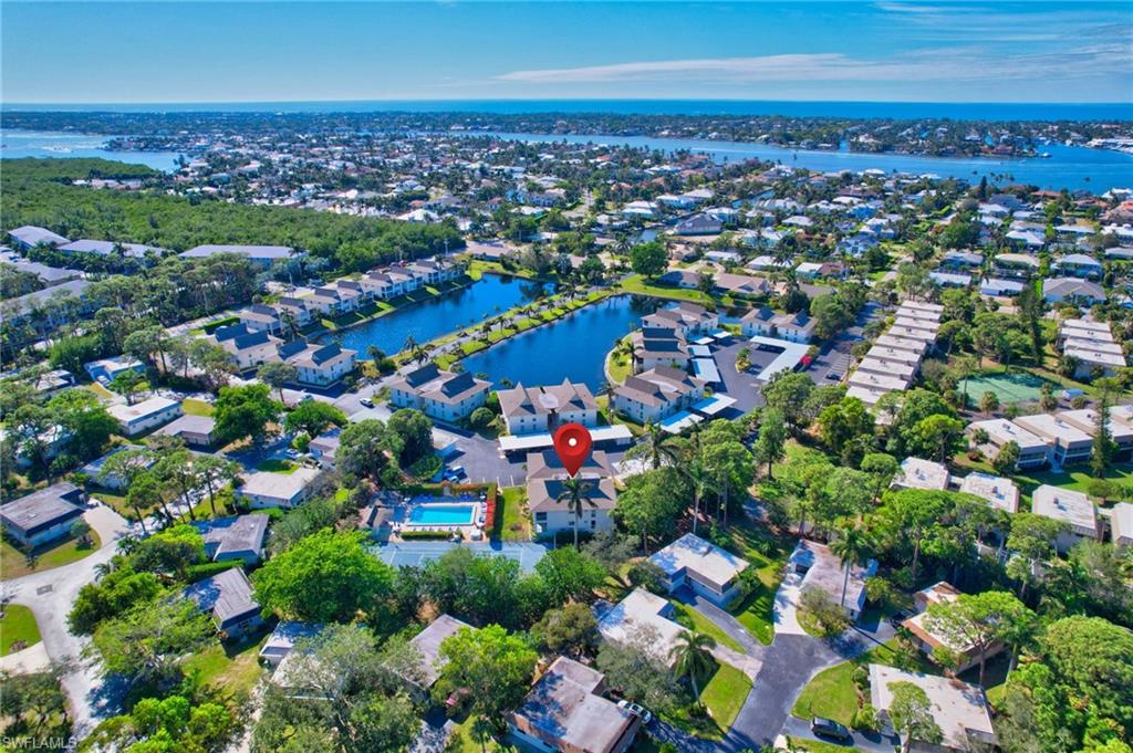 115 Georgetown Boulevard, Unit 115 Naples, FL 34112 - Photo 33 of 45 an aerial view of multiple house