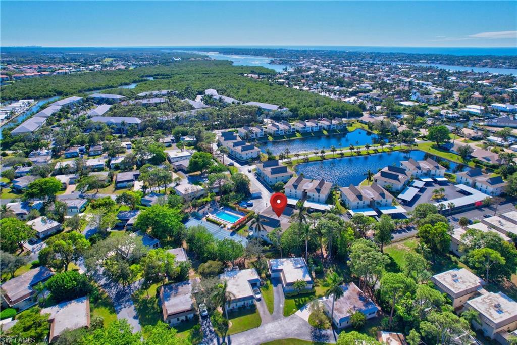 115 Georgetown Boulevard, Unit 115 Naples, FL 34112 - Photo 34 of 45 an aerial view of a city