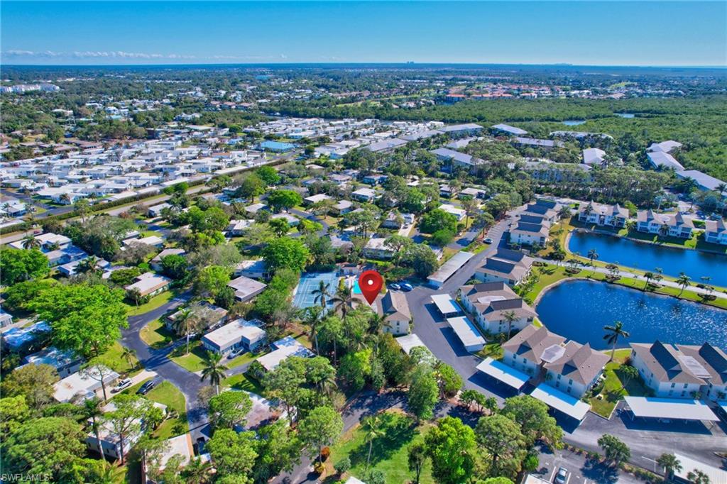 115 Georgetown Boulevard, Unit 115 Naples, FL 34112 - Photo 35 of 45 an aerial view of a houses and an outdoor space