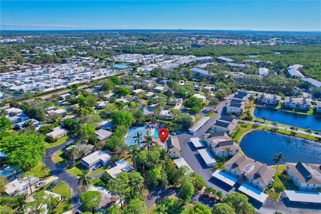 115 Georgetown Boulevard, Unit 115 Naples, FL 34112 - Photo 39 of 45 an aerial view of residential houses with outdoor space and swimming pool