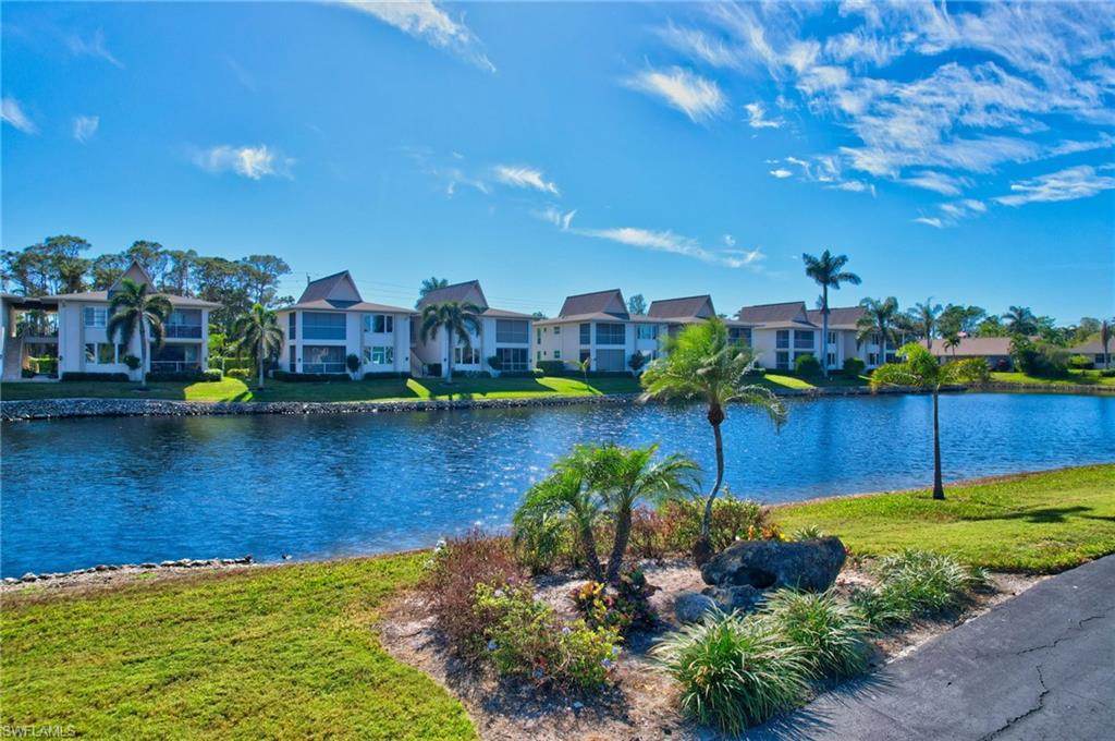 115 Georgetown Boulevard, Unit 115 Naples, FL 34112 - Photo 44 of 45 a view of a lake with houses