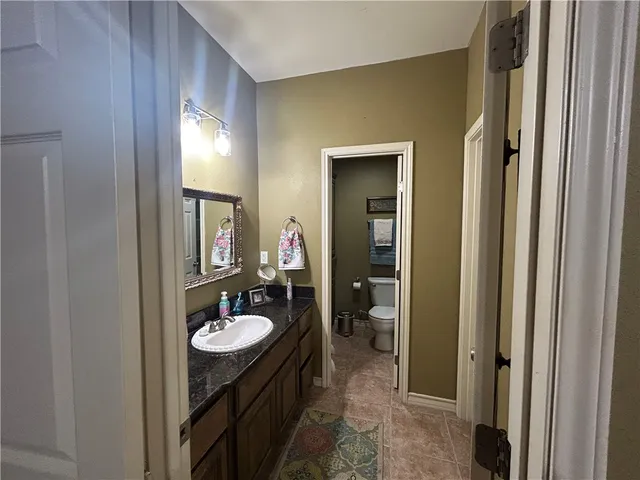 a bathroom with a sink a mirror and a shower