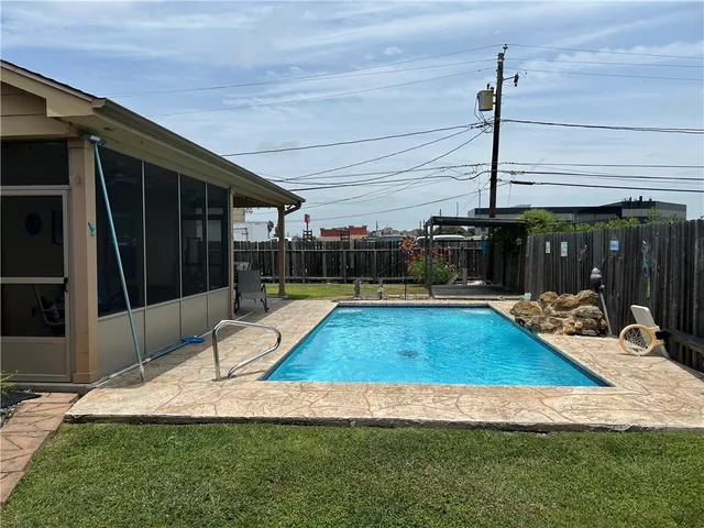 a view of a backyard with a patio