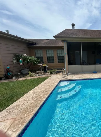 a front view of house with yard and outdoor seating
