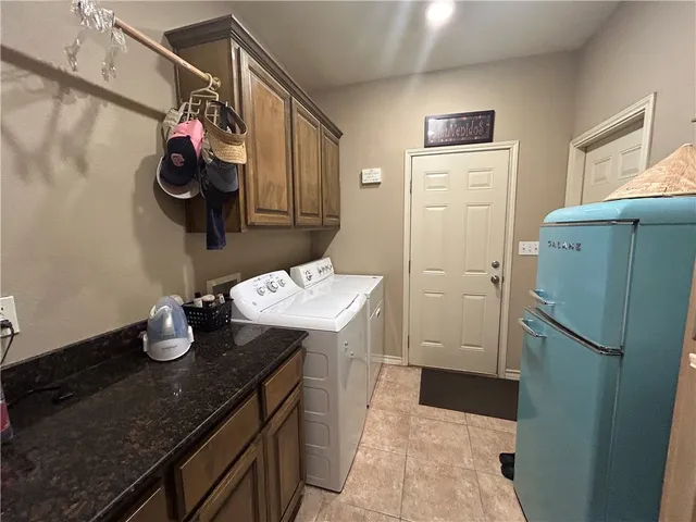 a kitchen with a sink and refrigerator