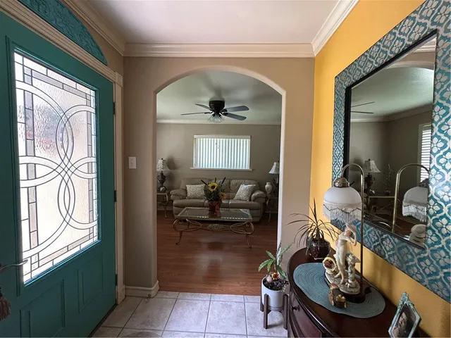 a living room with furniture a window and a fireplace