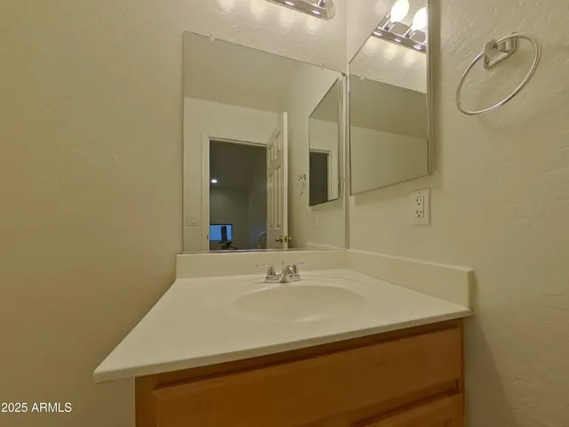 a white toilet sitting next to a shower