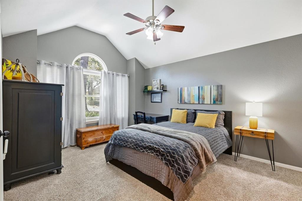 524 Post Oak Road Grapevine, TX 76051 - Photo 31 of 37 Vaulted ceiling with ceiling fan, arched window, and carpeted flooring