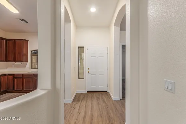 a view of a kitchen from the hallway