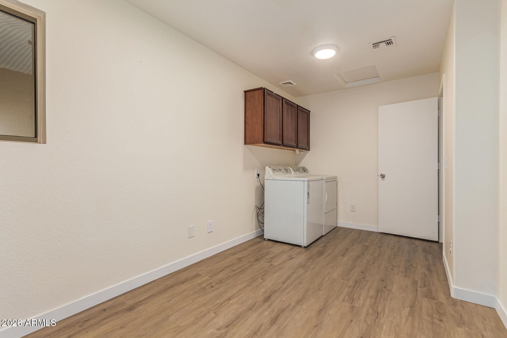 2101 South Meridian Road, Unit 428 Apache Junction, AZ 85120 - Photo 18 of 23 a view of a room with wooden floor and a sink