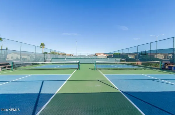 a view of an outdoor space and tennis court