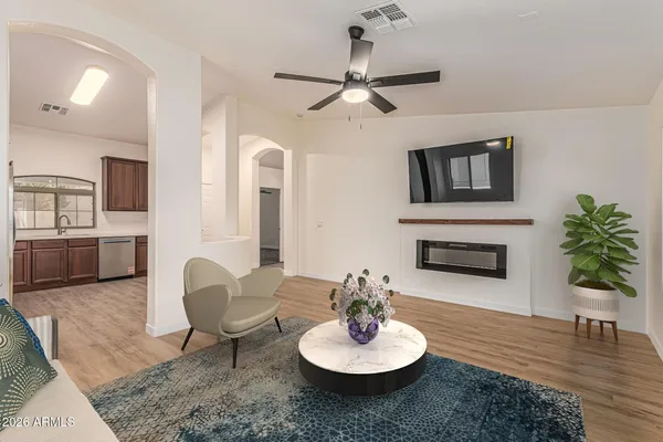 a living room with furniture and a fireplace