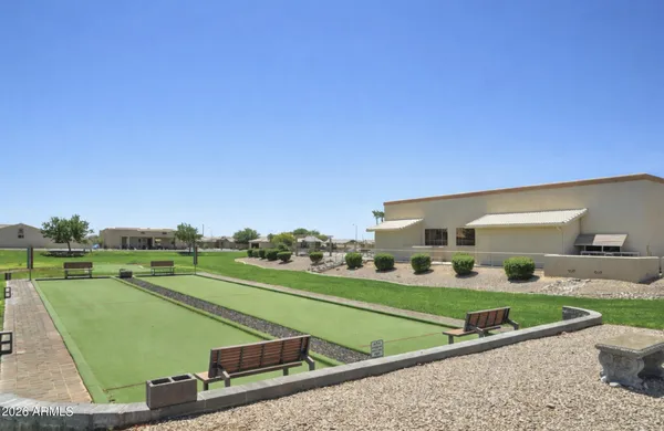 a view of a swimming pool with a yard
