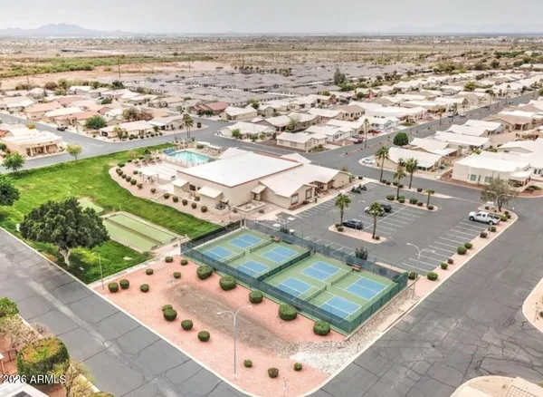 a view of a swimming pool with a yard