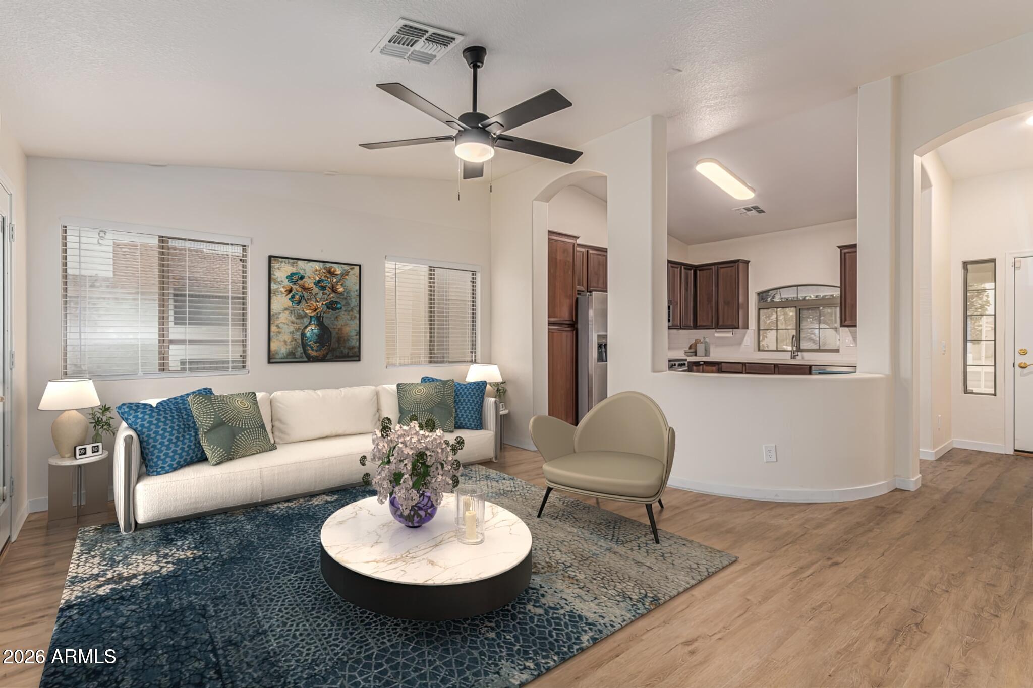 2101 South Meridian Road, Unit 428 Apache Junction, AZ 85120 - Photo 5 of 23 a living room with furniture and kitchen view