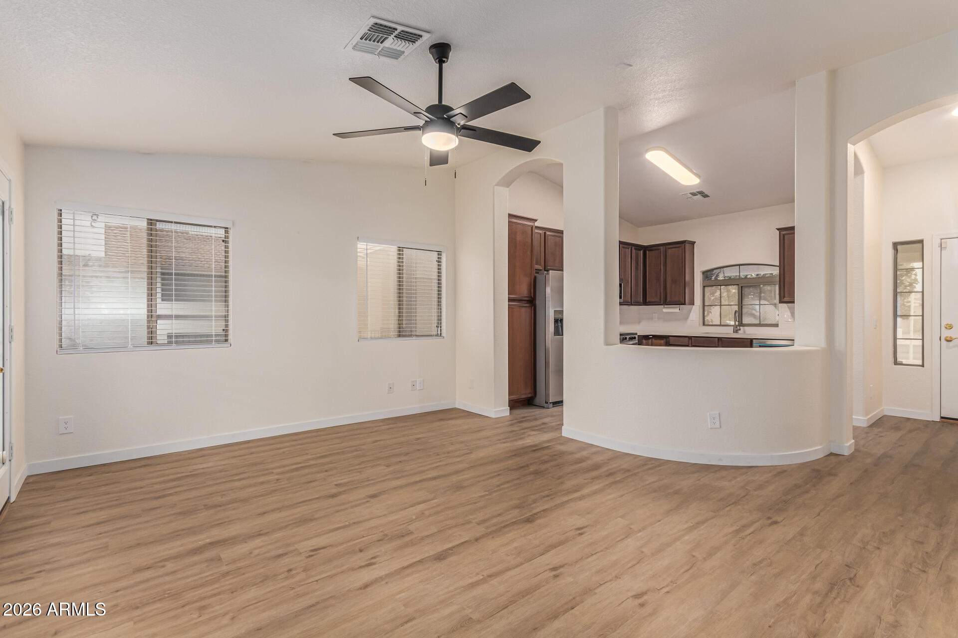 2101 South Meridian Road, Unit 428 Apache Junction, AZ 85120 - Photo 6 of 23 a view of a kitchen with wooden floor and a kitchen space