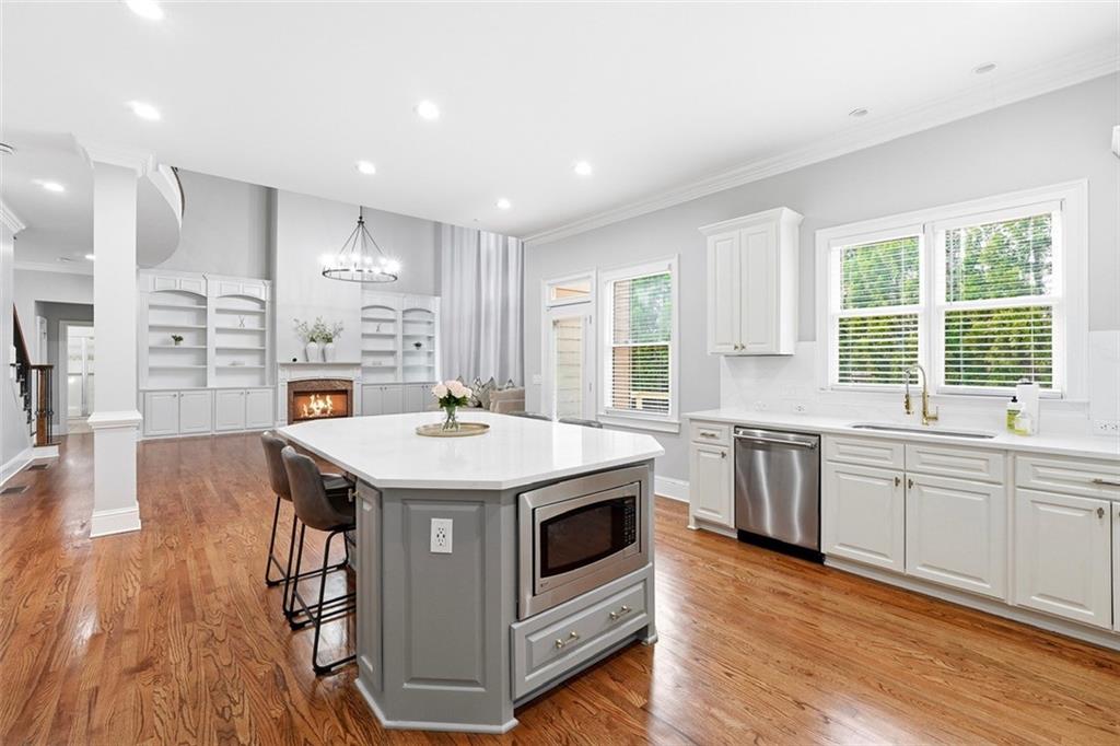 2555 Weddington Ridge Northeast Marietta, GA 30068 - Photo 15 of 65 a kitchen with stainless steel appliances granite countertop a stove and a wooden floors