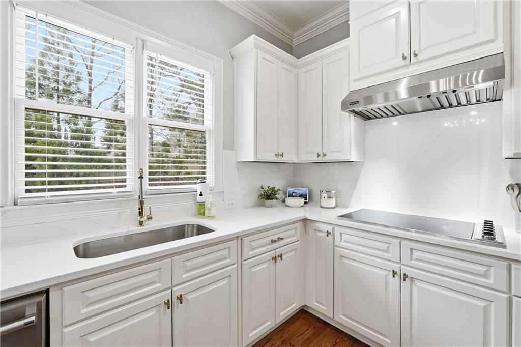 2555 Weddington Ridge Northeast Marietta, GA 30068 - Photo 16 of 65 a kitchen with stainless steel appliances granite countertop a sink a oven and white cabinets