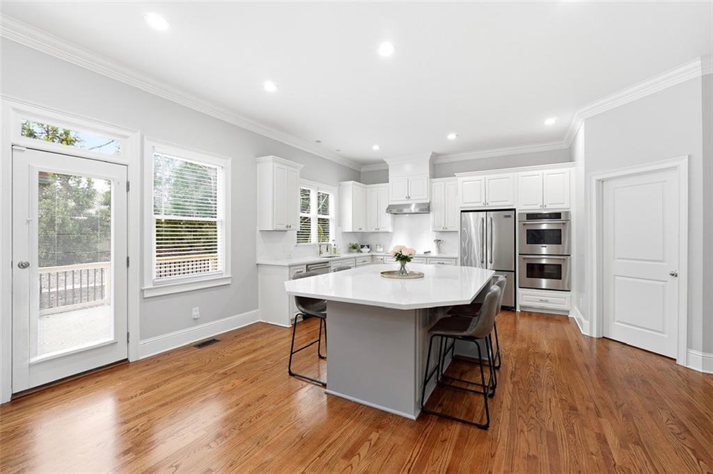 2555 Weddington Ridge Northeast Marietta, GA 30068 - Photo 19 of 65 a view of a dining room with furniture window and wooden floor