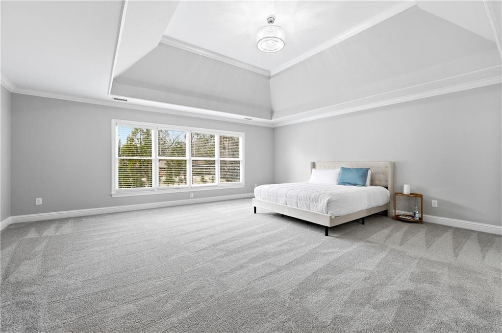 2555 Weddington Ridge Northeast Marietta, GA 30068 - Photo 23 of 65 a spacious bedroom with a bed and a window