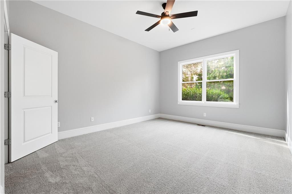 2555 Weddington Ridge Northeast Marietta, GA 30068 - Photo 34 of 65 wooden floor in an empty room with a window