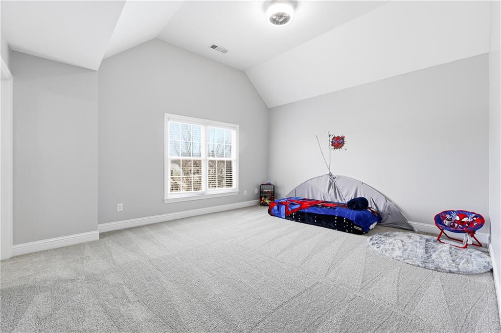 2555 Weddington Ridge Northeast Marietta, GA 30068 - Photo 36 of 65 a bedroom with bed and a closet