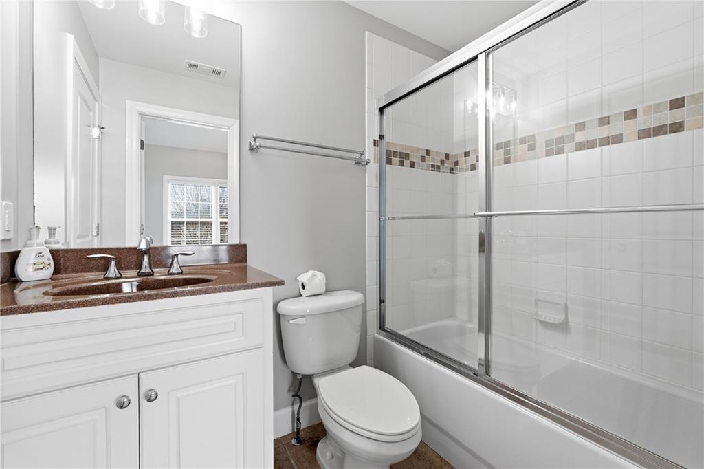 2555 Weddington Ridge Northeast Marietta, GA 30068 - Photo 42 of 65 a bathroom with a toilet a sink and a bathtub