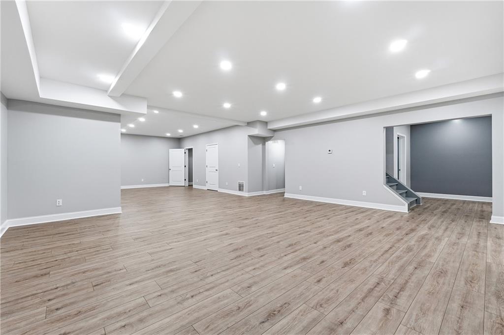 2555 Weddington Ridge Northeast Marietta, GA 30068 - Photo 48 of 65 a view of an empty room with wooden floor