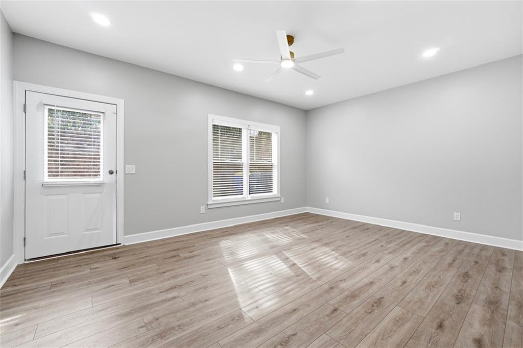 2555 Weddington Ridge Northeast Marietta, GA 30068 - Photo 51 of 65 a view of an empty room with wooden floor and a window