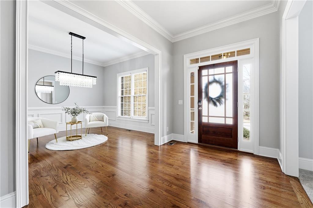 2555 Weddington Ridge Northeast Marietta, GA 30068 - Photo 6 of 65 a view of a livingroom with furniture wooden floor and windows