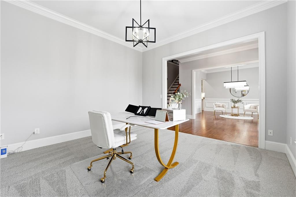 2555 Weddington Ridge Northeast Marietta, GA 30068 - Photo 8 of 65 a view of a room with a chandelier and wooden floor