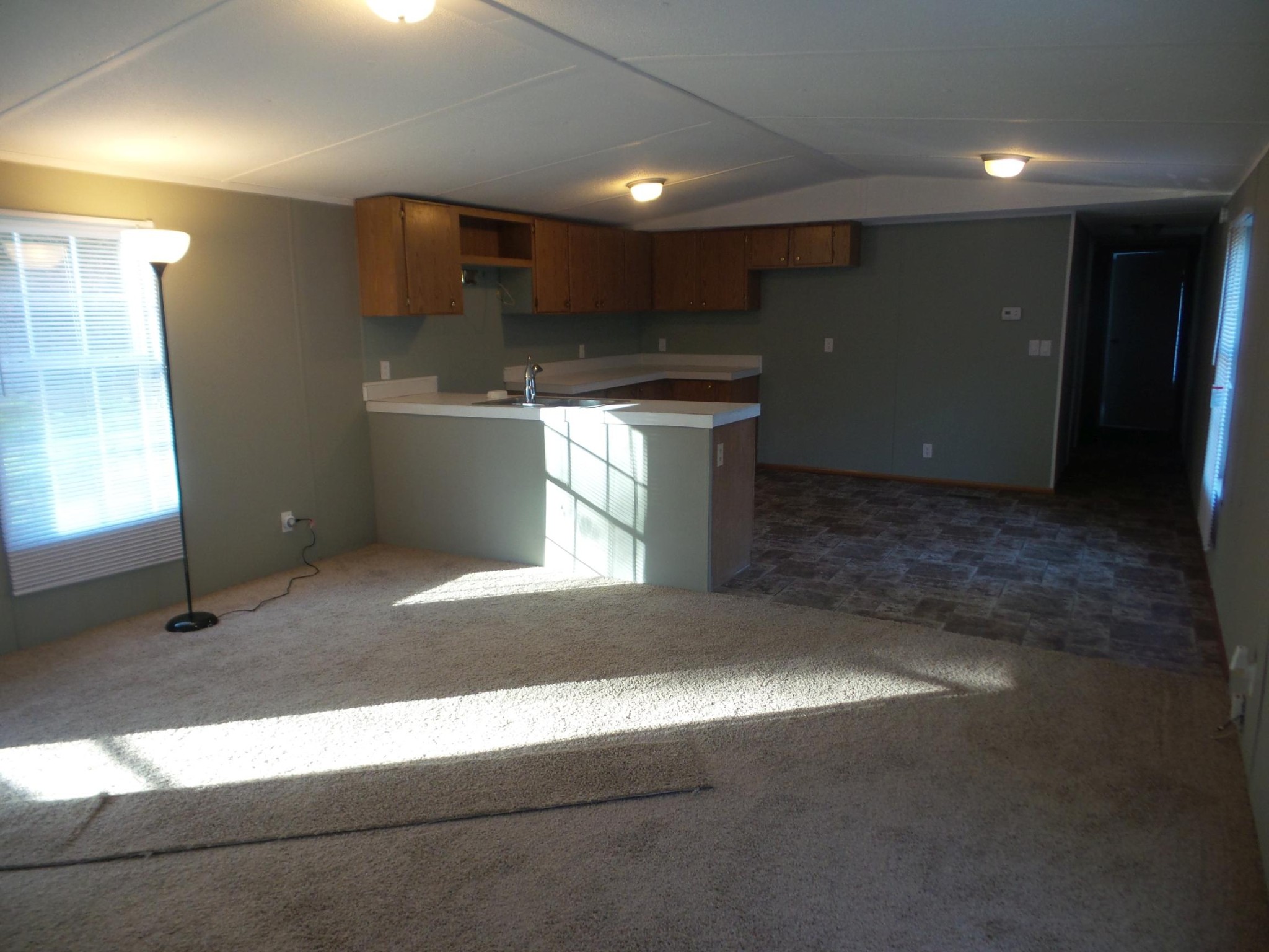 386 Ideal Valley Road Spring City, TN 37381 - Photo 2 of 12 a kitchen with stainless steel appliances kitchen island granite countertop a sink and a stove