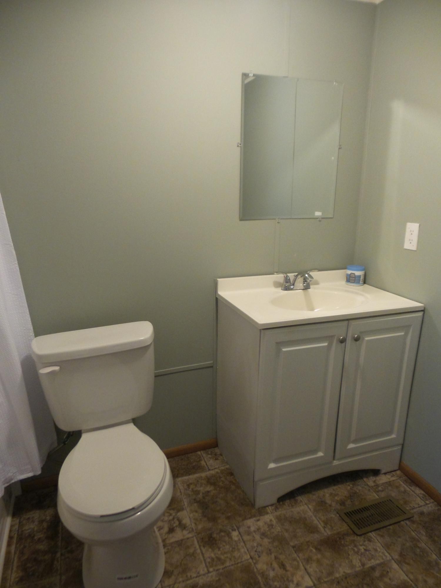386 Ideal Valley Road Spring City, TN 37381 - Photo 5 of 12 a bathroom with a toilet sink and mirror