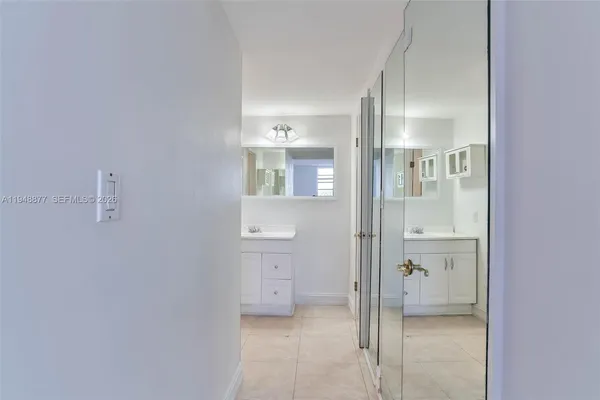 a bathroom with a glass shower door