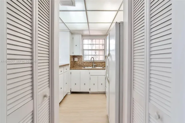 a bathroom with a sink and mirror