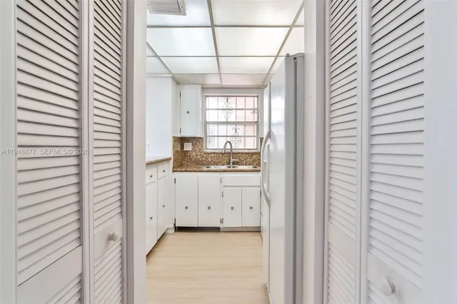 a bathroom with a sink and mirror
