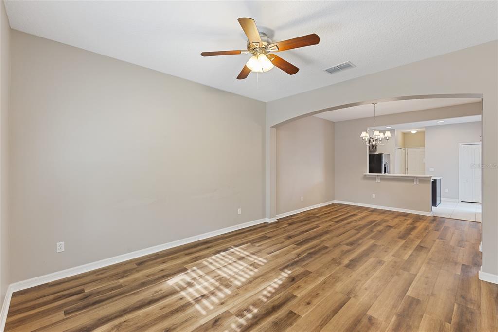 506 Rainbow Springs Loop Groveland, FL 34736 - Photo 2 of 30 a view of empty room with wooden floor