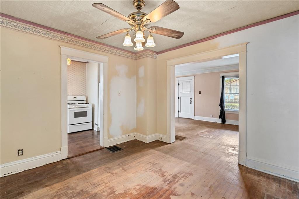 214 Sarah Street McKees Rocks, PA 15136 - Photo 15 of 28 a view of a hallway with a chandelier fan and windows