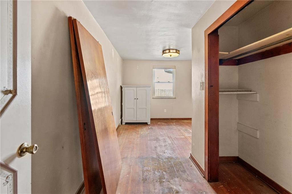 214 Sarah Street McKees Rocks, PA 15136 - Photo 16 of 28 a view of a hallway with wooden floor and closet
