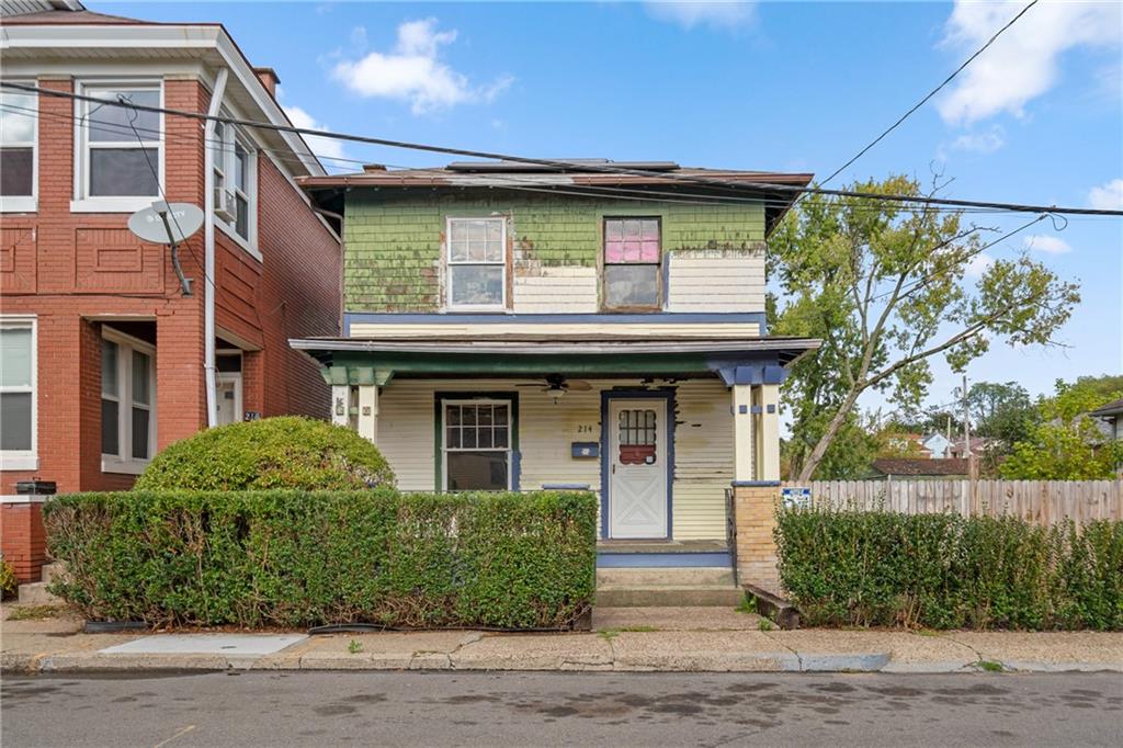 214 Sarah Street McKees Rocks, PA 15136 - Photo 2 of 28 a front view of a house with garden
