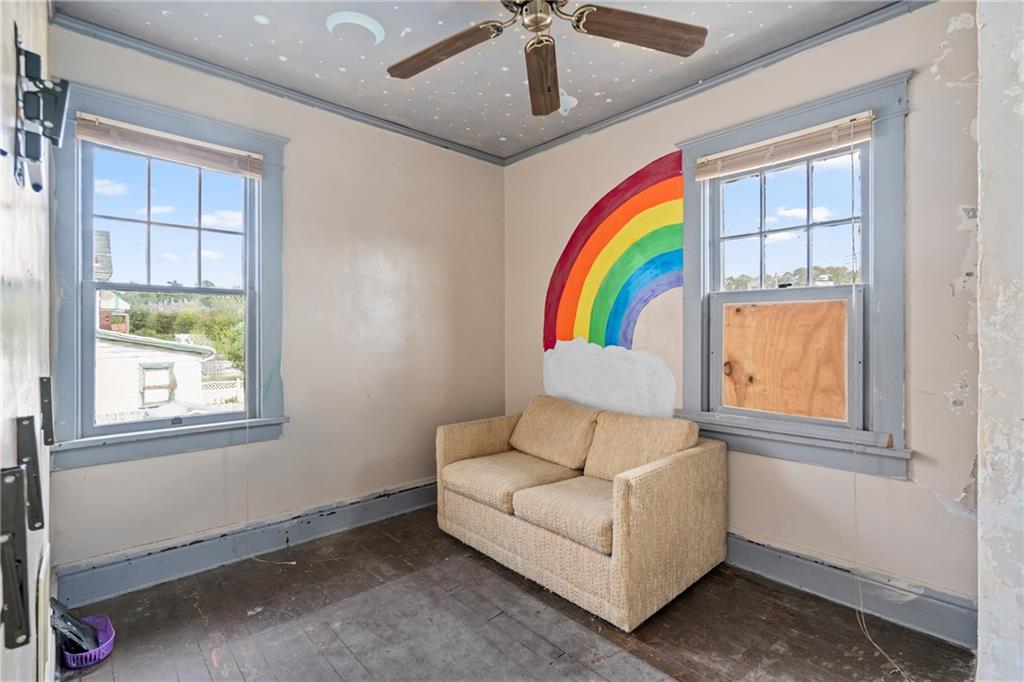 214 Sarah Street McKees Rocks, PA 15136 - Photo 24 of 28 a living room with windows and a ceiling fan