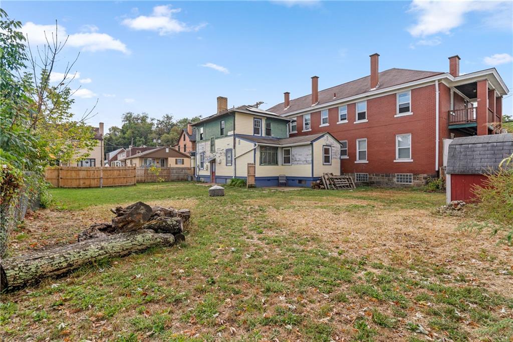 214 Sarah Street McKees Rocks, PA 15136 - Photo 3 of 28 a front view of a house with a garden