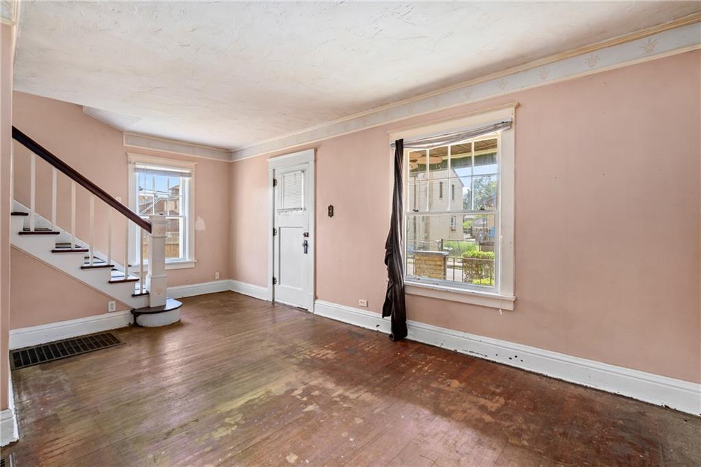 214 Sarah Street McKees Rocks, PA 15136 - Photo 8 of 28 a view of an empty room with wooden floor and a window